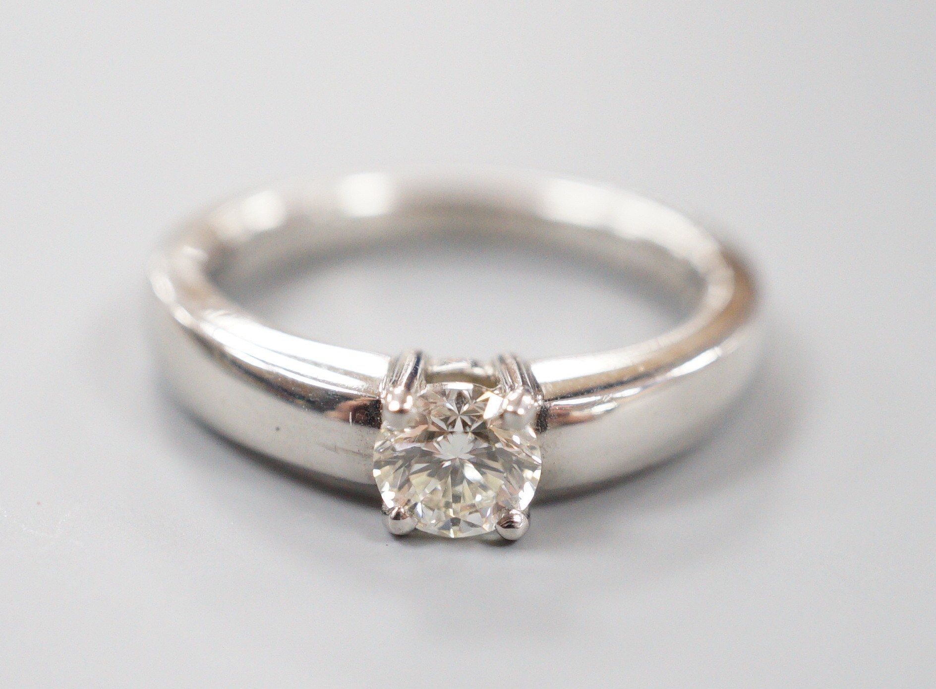 A modern platinum and solitaire diamond ring, size M, gross weight 8.7 grams